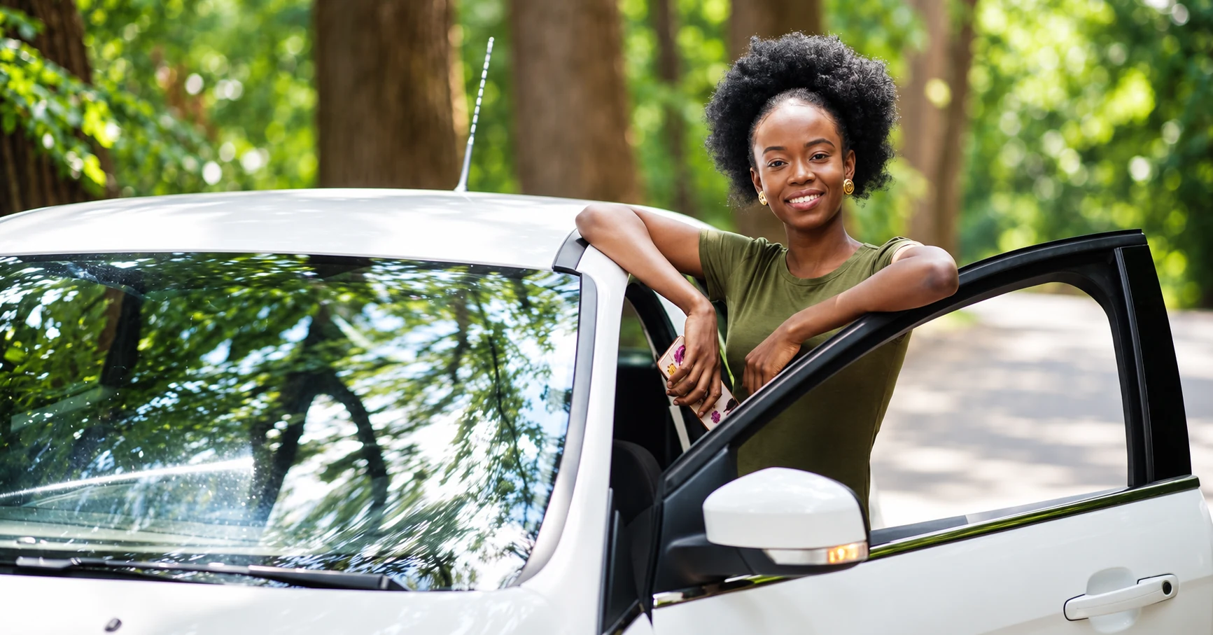 A car owner beside her car — illustrative lifestyle photography